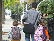 Celebrating Unification image of family walking from behind